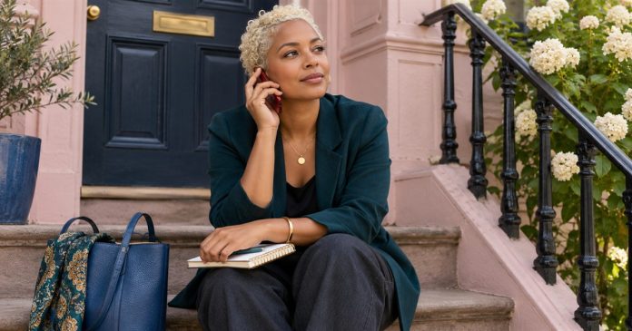 Signs You Are in a Karmic Relationship: The Pattern, the Useful Reading, and the Line Not to Cross — cover A woman sits on front steps speaking on a red phone.